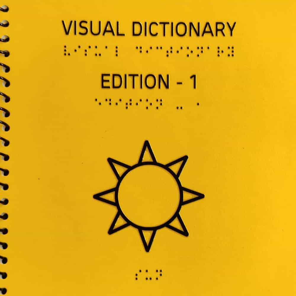 Front page of Braille Visual Dictionary Edition - 1 showing the headings and a photo of sun
