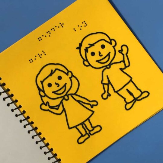 A photo of a boy and a girl with braille script in Braille Learning Opposites tactile picture braille Book by Beyond Braille